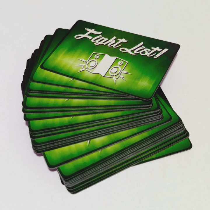 Face-down deck of cards. The card back is a drawing of white speakers against a green background