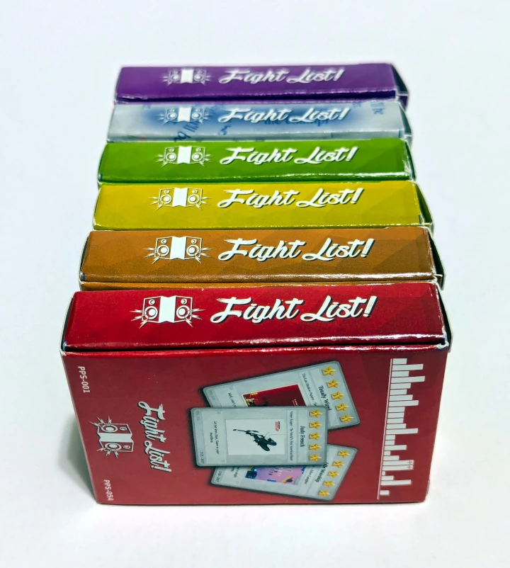 Six deck boxes on their sides: red, orange, yellow, green, blue, and purple