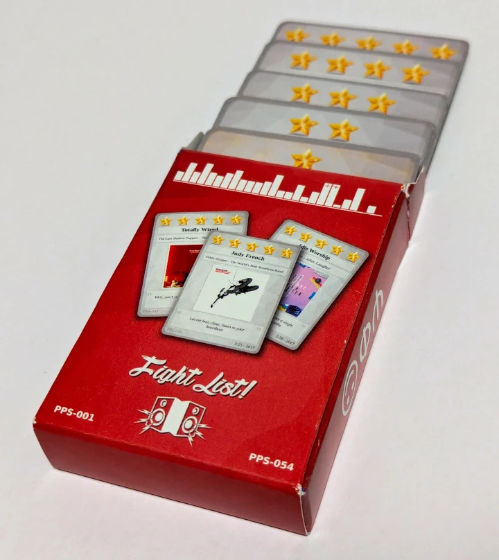 The back of a deck box, showing the faces of three cards