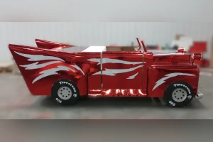 Red car with white lightning bolt stripes